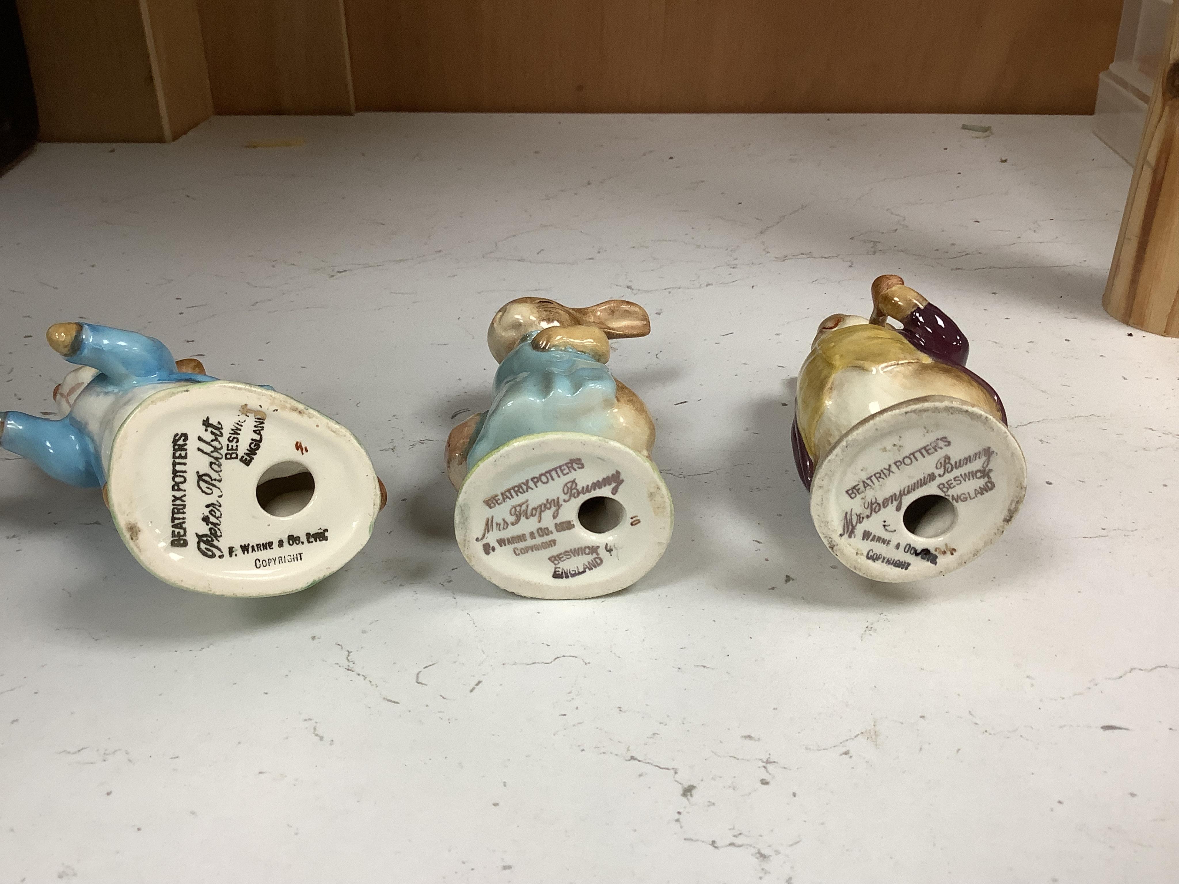 Nine Beswick Beatrix Potter figures, some stamped F. Warne & Co , largest 17cm high